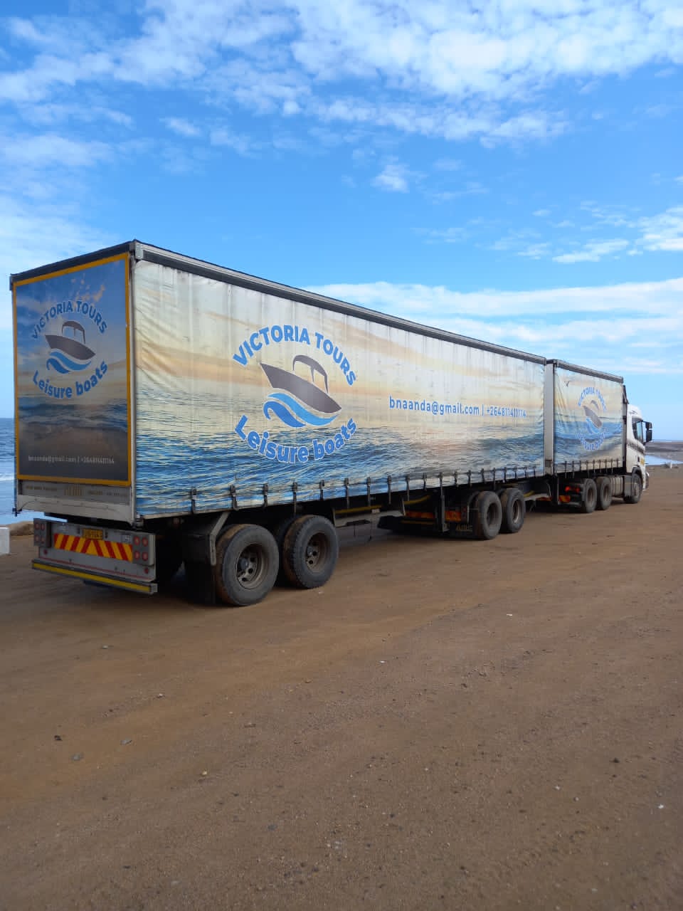 Topaz Atlantic Logistics interlink curtain-side trailers parked on the Atlantic shoreline